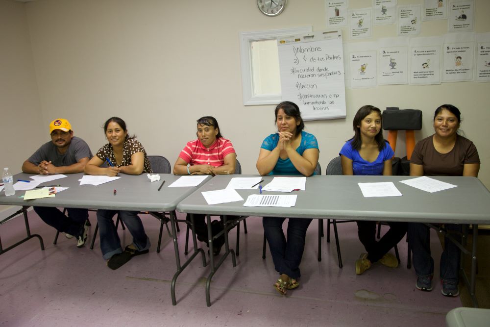 A group of people sitting at a table.