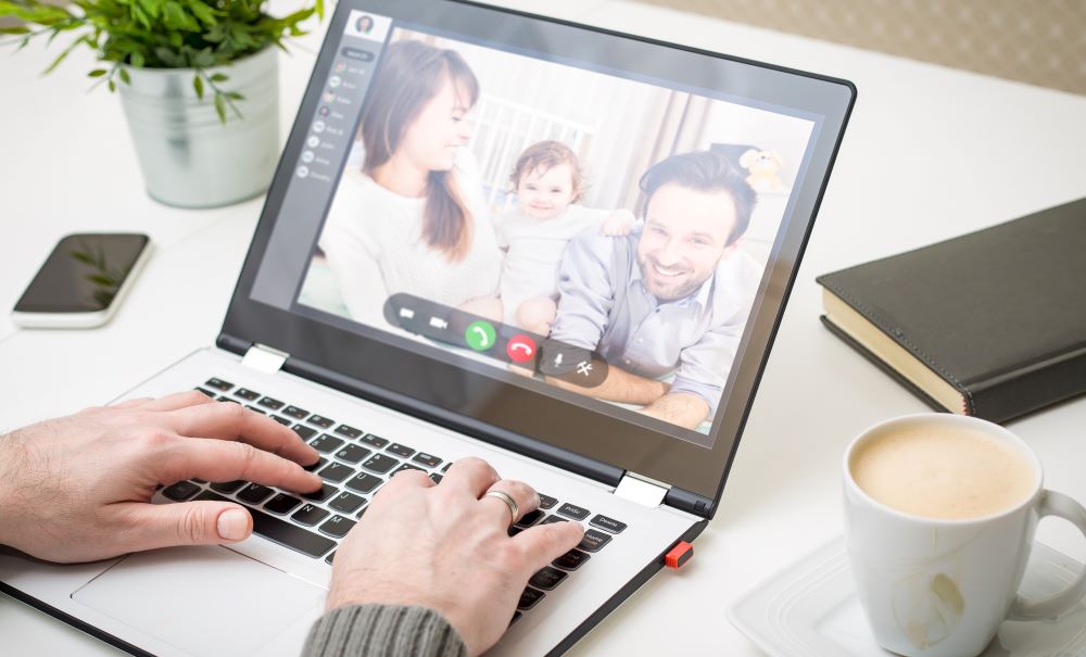 A view of a staff members computer screen showing a virtual check-in with a family.