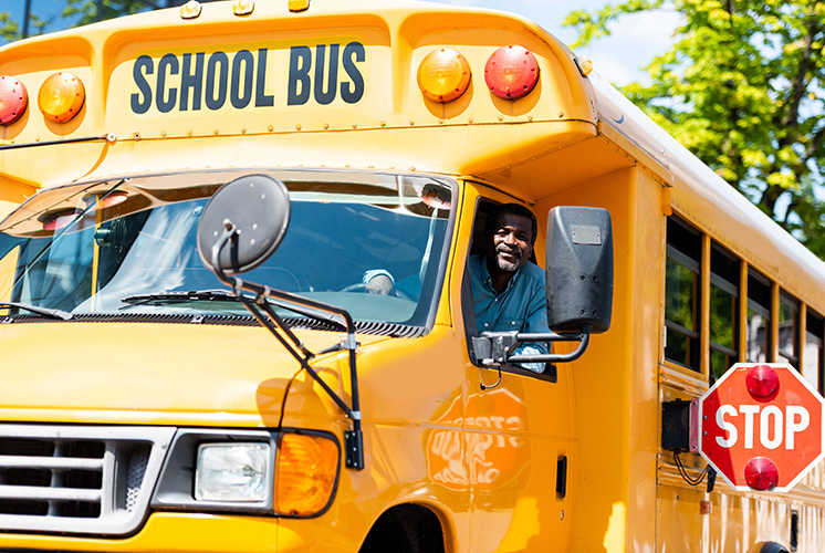 School bus displaying the stop sign.