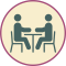 Icono de matriculación de dos personas en una mesa.