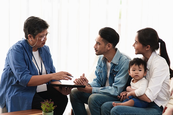 Family service worker speaking with a family.