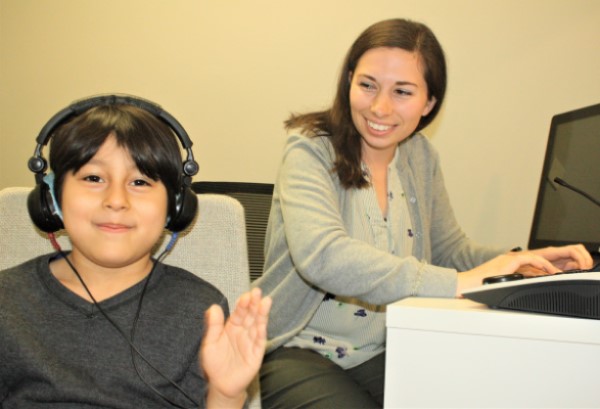 Child being administered a puretone hearing test.