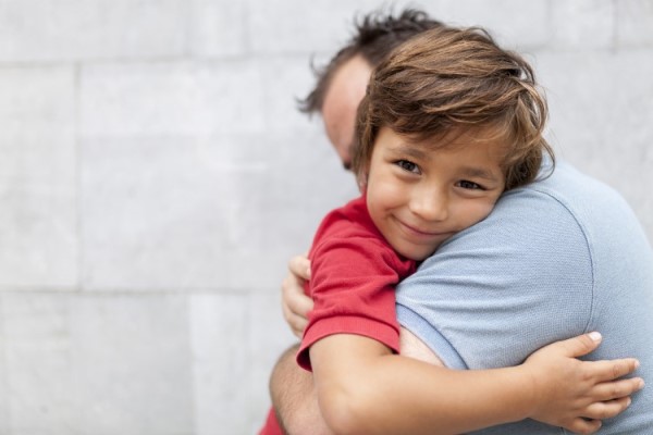 Father hugging his child.