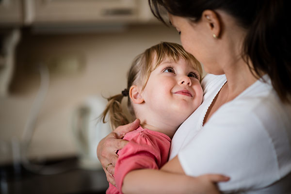 Mother holding her child in her arms.