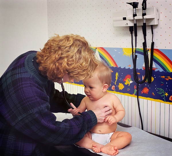 Child checked by a doctor.