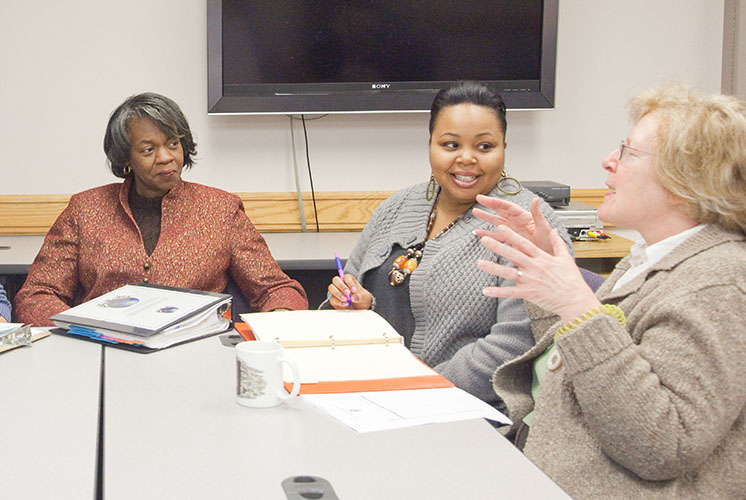 Group of managers in a meeting room.