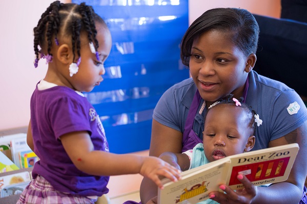 Teacher reading a story to children in a classroom