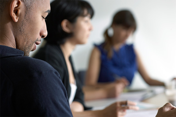 Staff reviewing applications.