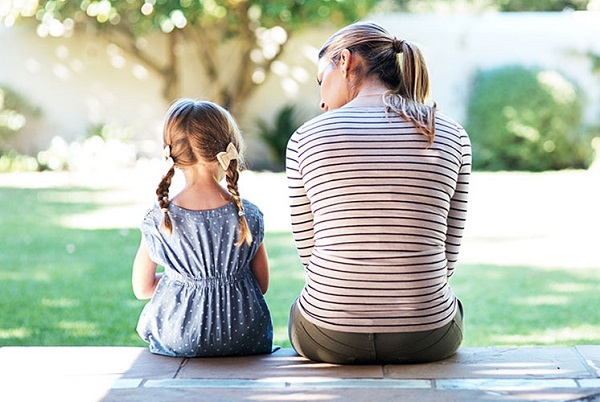 Mother talking with her child at a park.