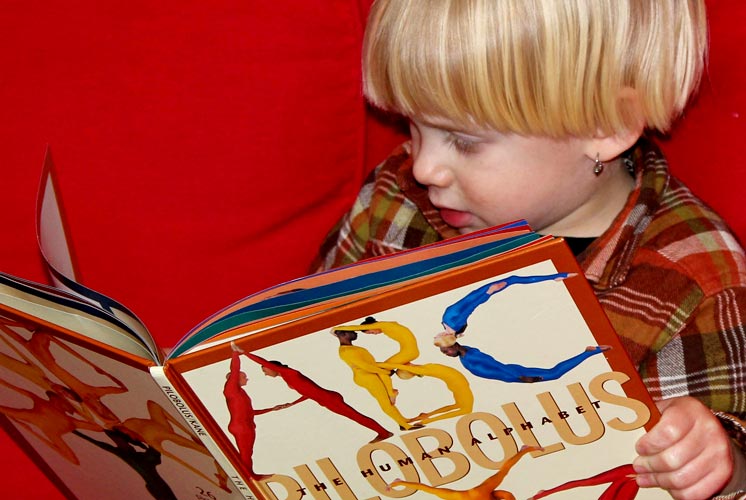 woman reading to child