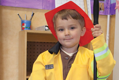 child in firefighter costume