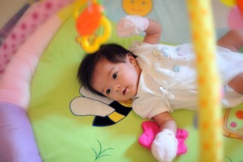 baby laying in crib