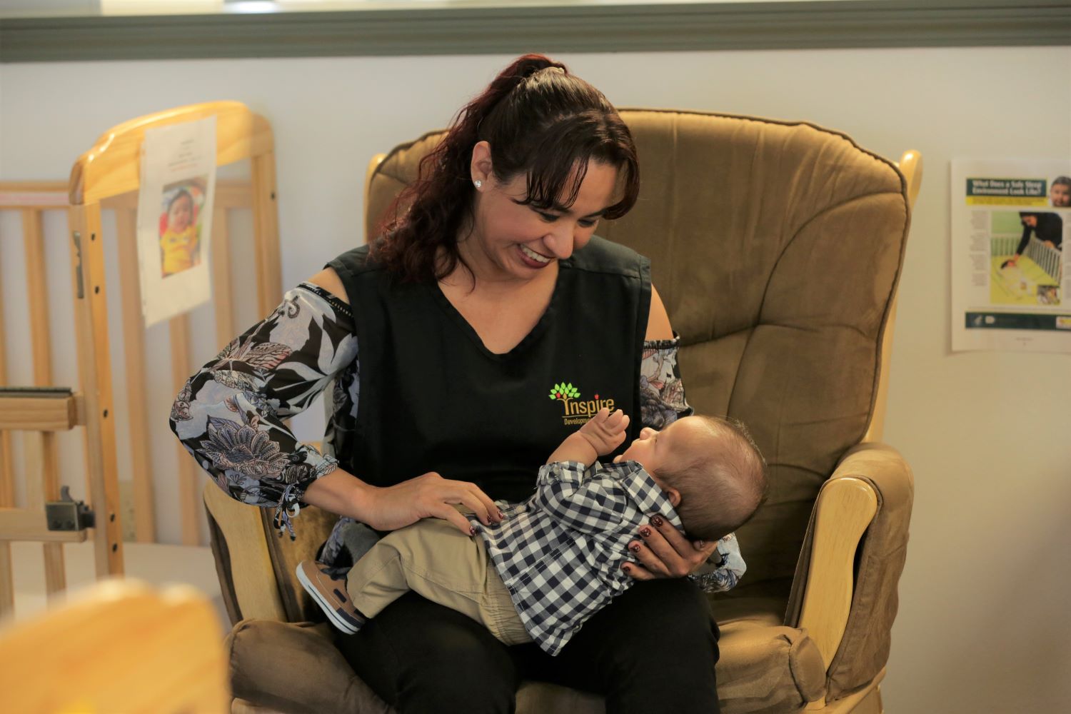 Caregiver breastfeeding infant.