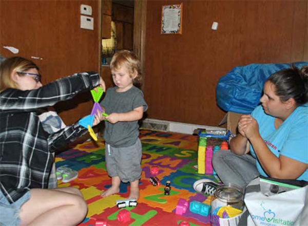 Mother and her son with a Child Development Specialist