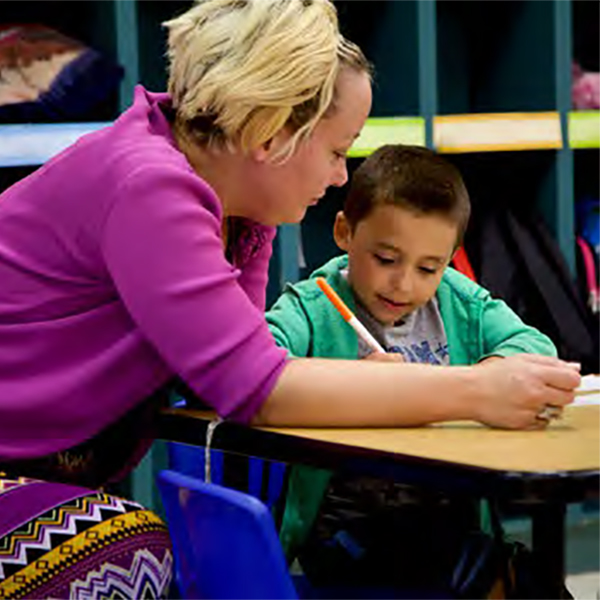 Teacher helping a child