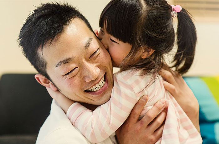 Father hugging his daughter