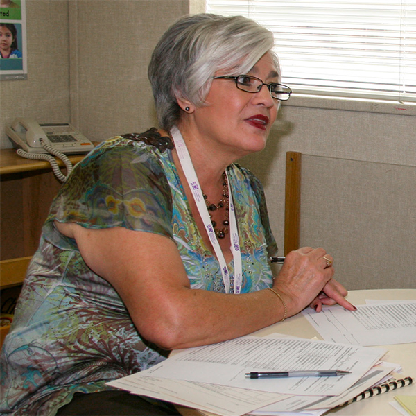 Family services manager filling out paperwork