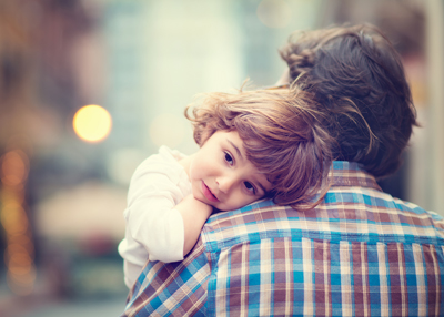 Father holding daughter