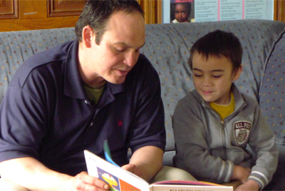 Father reading to son