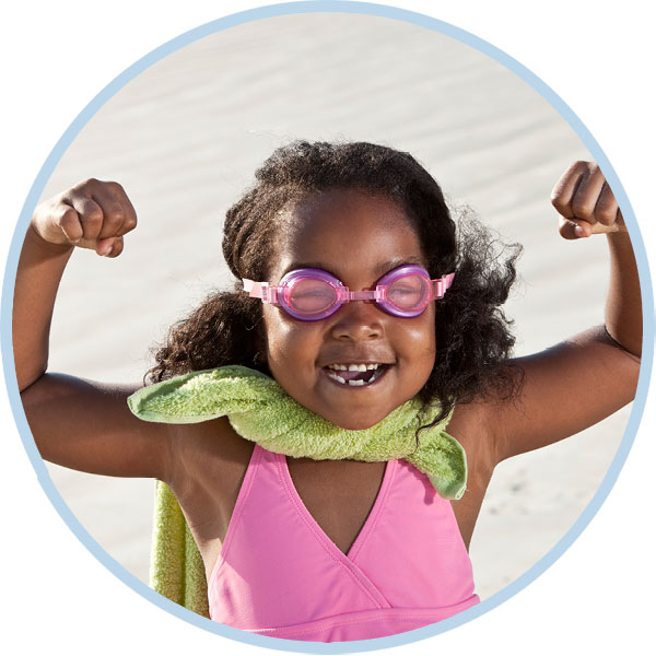 Toddler girl dressed up like a super hero