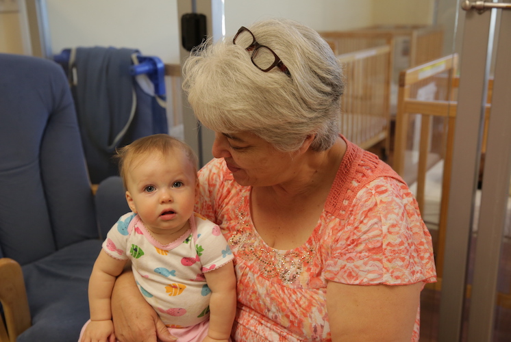 Grandmother holding grandchild