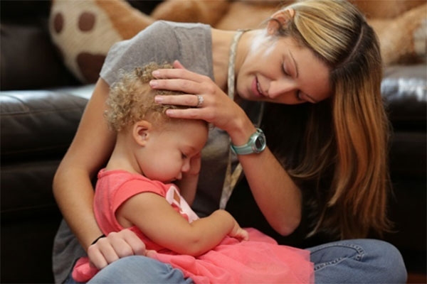 Mother and child sitting on the floor