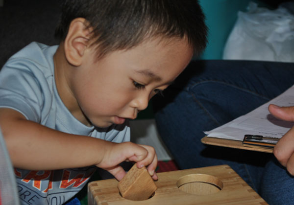 Little boy playing with blocks