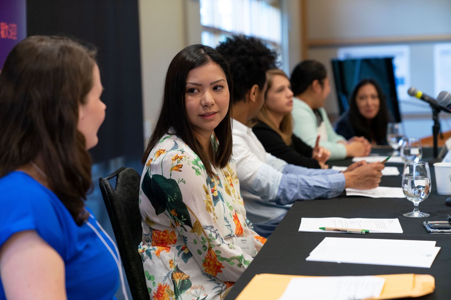 Group of women hosting a meeting.