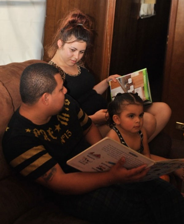 Parents with their children reading