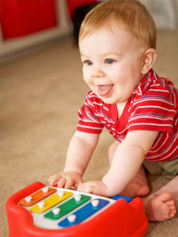 child playing with xylophone