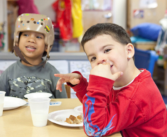 Kids smiling and eating