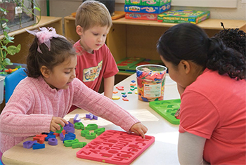 children playing with letters