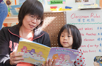 women reading to child