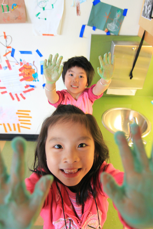 Little kids with painted hands