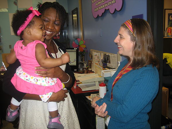 Parent and Teacher with child