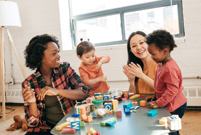 Parents and kids playing with blocks