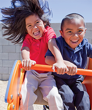 Two children playing on the playground