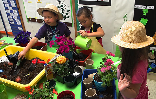 Students learning how to garden