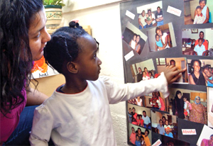 woman and girl looking at photos