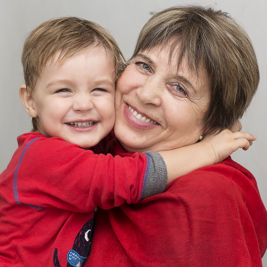 Grandmother hugging her grandson